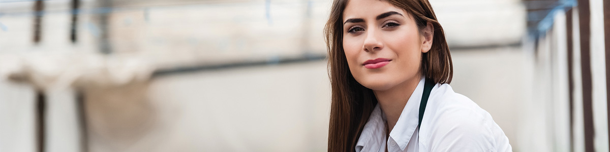 smiling woman in hot house