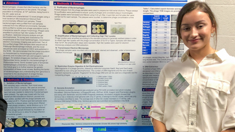 student with research poster