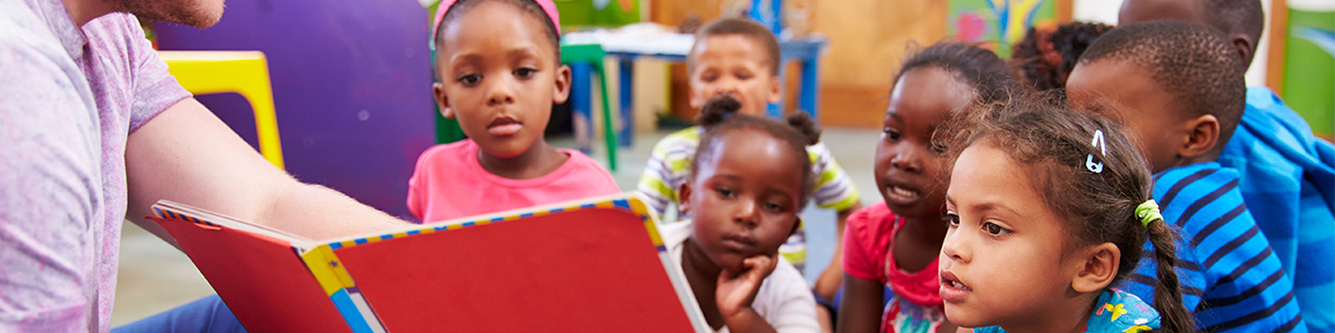 PTK student reading to young children