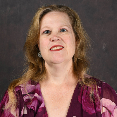 Profile photo of Jennifer Duncan, a Records Coordinator, in front of a professional backdrop
