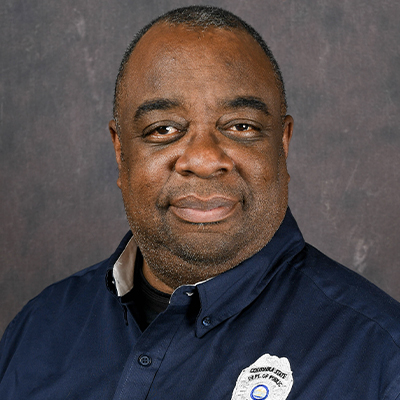 Profile photo of Marc Jett, Columbia Campus police officer, in front of a professional backdrop.