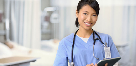 A nurse smiling at the camera