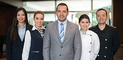 A group of business executives smiling at the camera