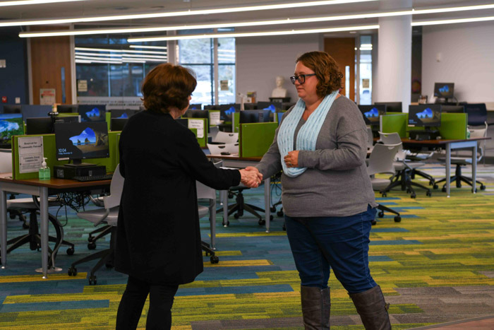 Dr. Janet F. Smith, Columbia State president, presents the 2023 Chancellor’s Commendation for Military Veterans to student Sarah Frazier.