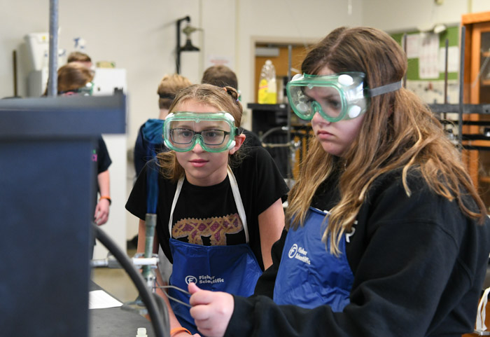 Students participate in a chemistry flame test at STEM Within Reach.