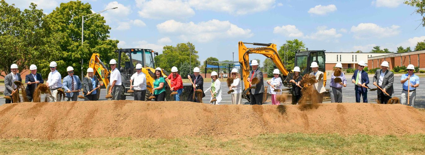 Officials shovel dirt at the SRTC groundbreaking