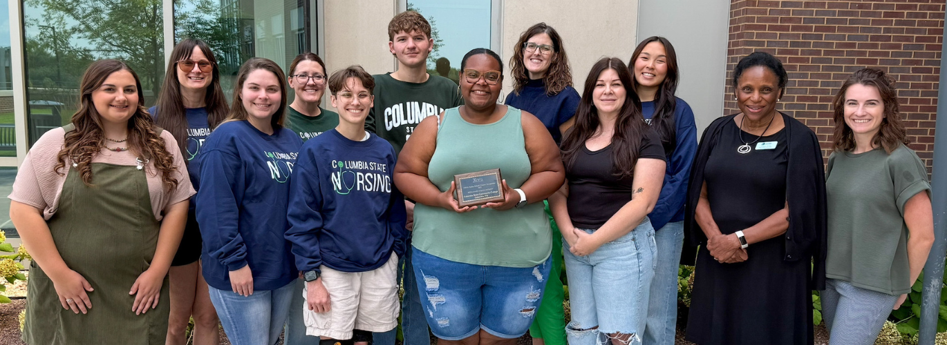 Columbia State students and faculty receive the NSNA Stellar School Chapter designation and award plaque.