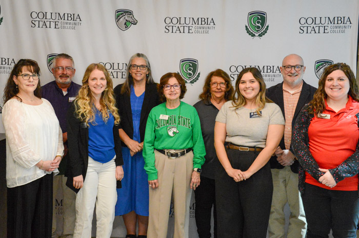 Dr. Janet F. Smith, Columbia State president (center), stands with several university representatives who attended the summit. 