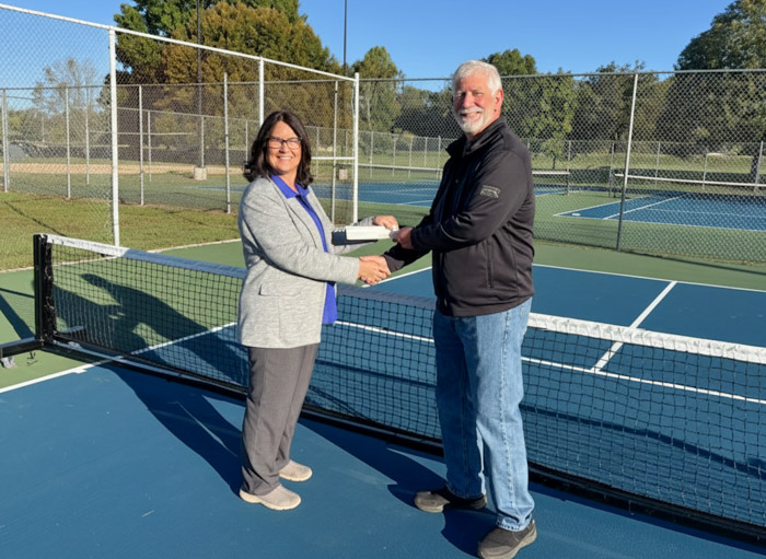 Pictured (left to right): Bethany Lay, Columbia State vice president for advancement and executive director of the Columbia State Foundation, receives a donation from CTPA Board Chair Chester Hale.