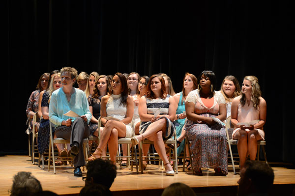 group of women sitting in chairs