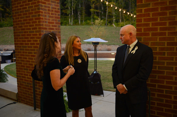 Cindy Hayes, Maria Gilbert and Mark Hayes, First National Bank chairman and CEO. 