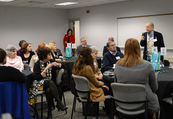 Dr. BI Naddy talked to donor breakfast attendees about his experiences. 