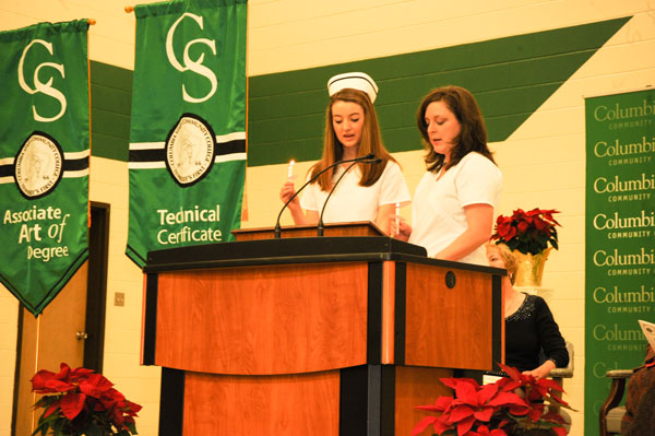 Two nurses holding candles