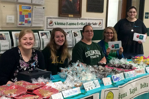 SKD students manning bake sale table