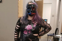 Student in mask with ripped clothing