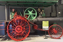 Student sitting on old tractor